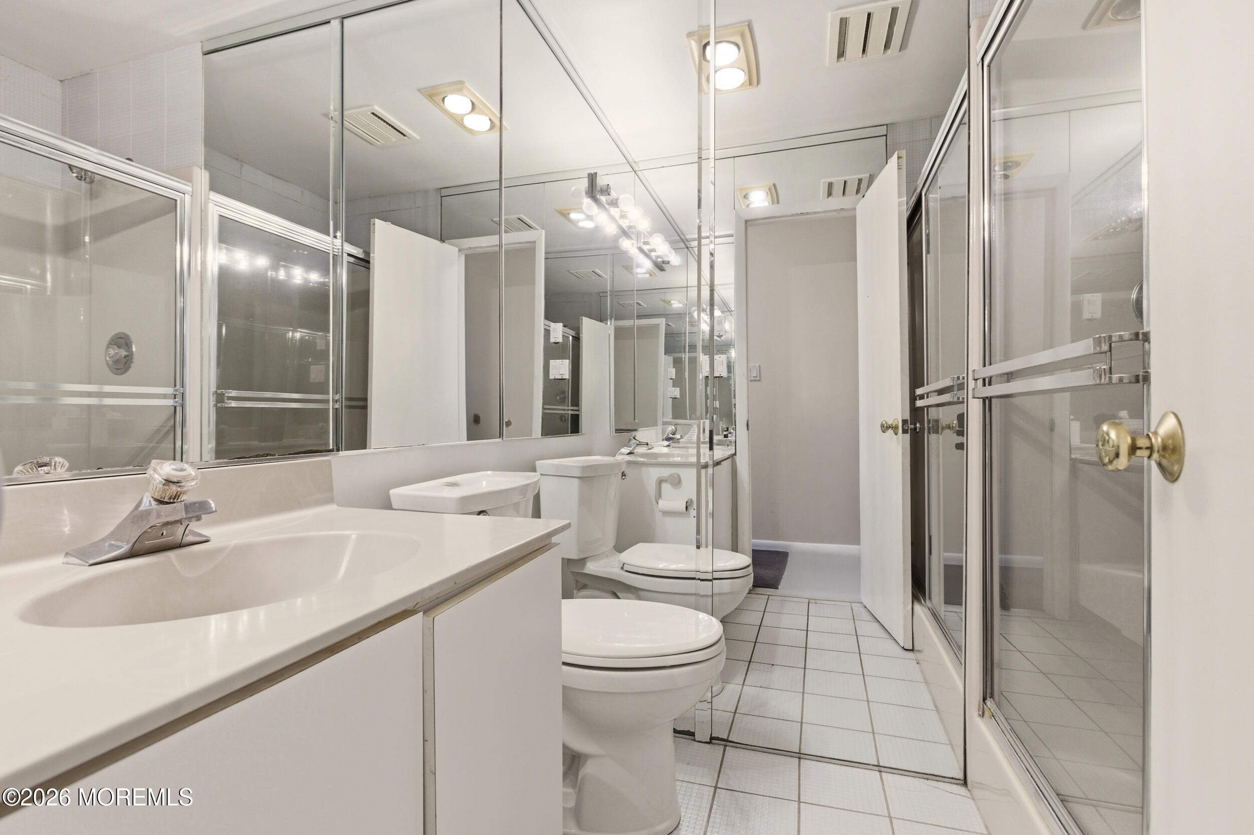 31 Chelsea Road Jackson, NJ 08527 - Photo 49 of 57 a bathroom with a sink a toilet and shower