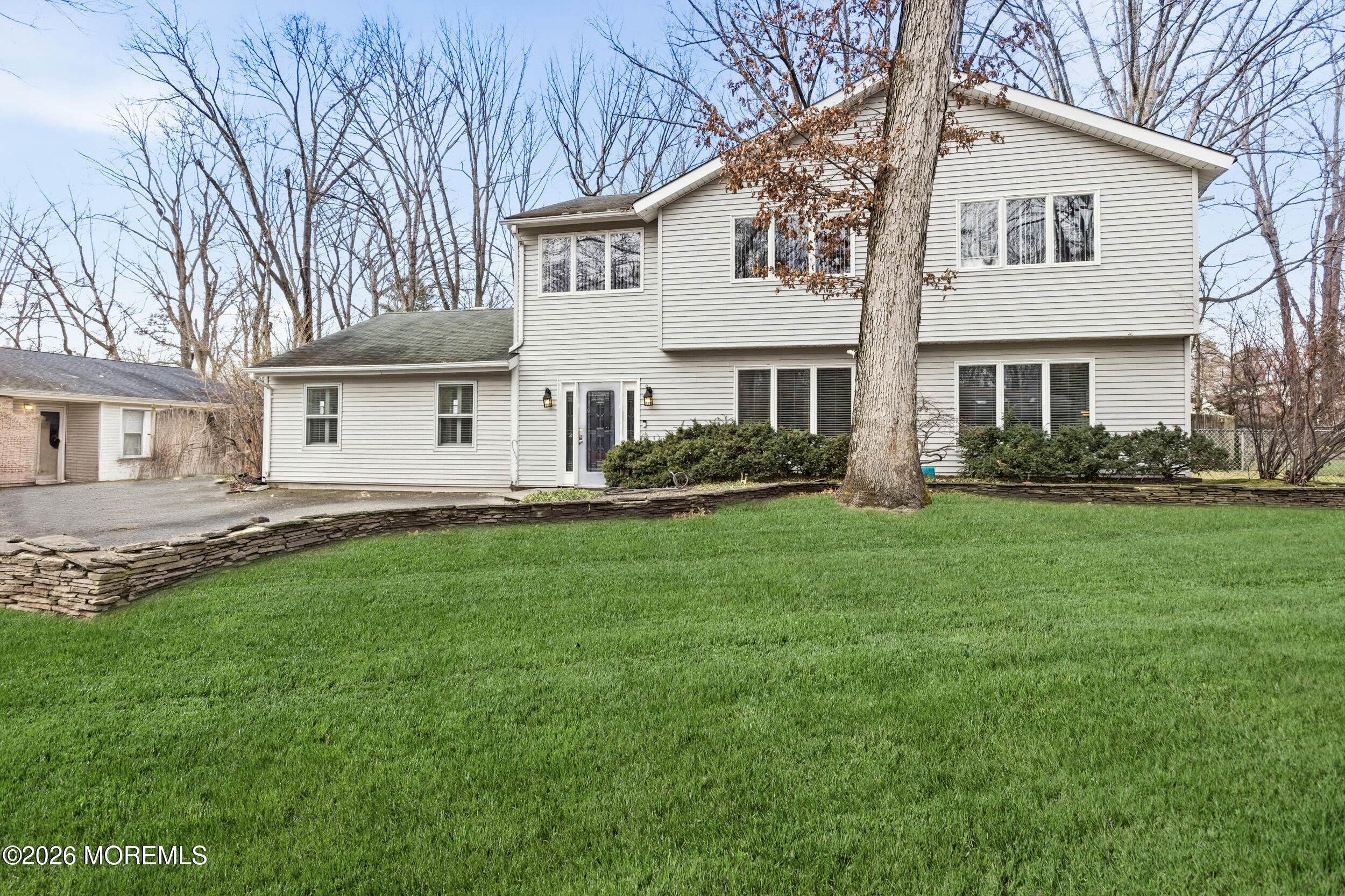 31 Chelsea Road Jackson, NJ 08527 - Photo 53 of 57 a view of a yard in front of a house
