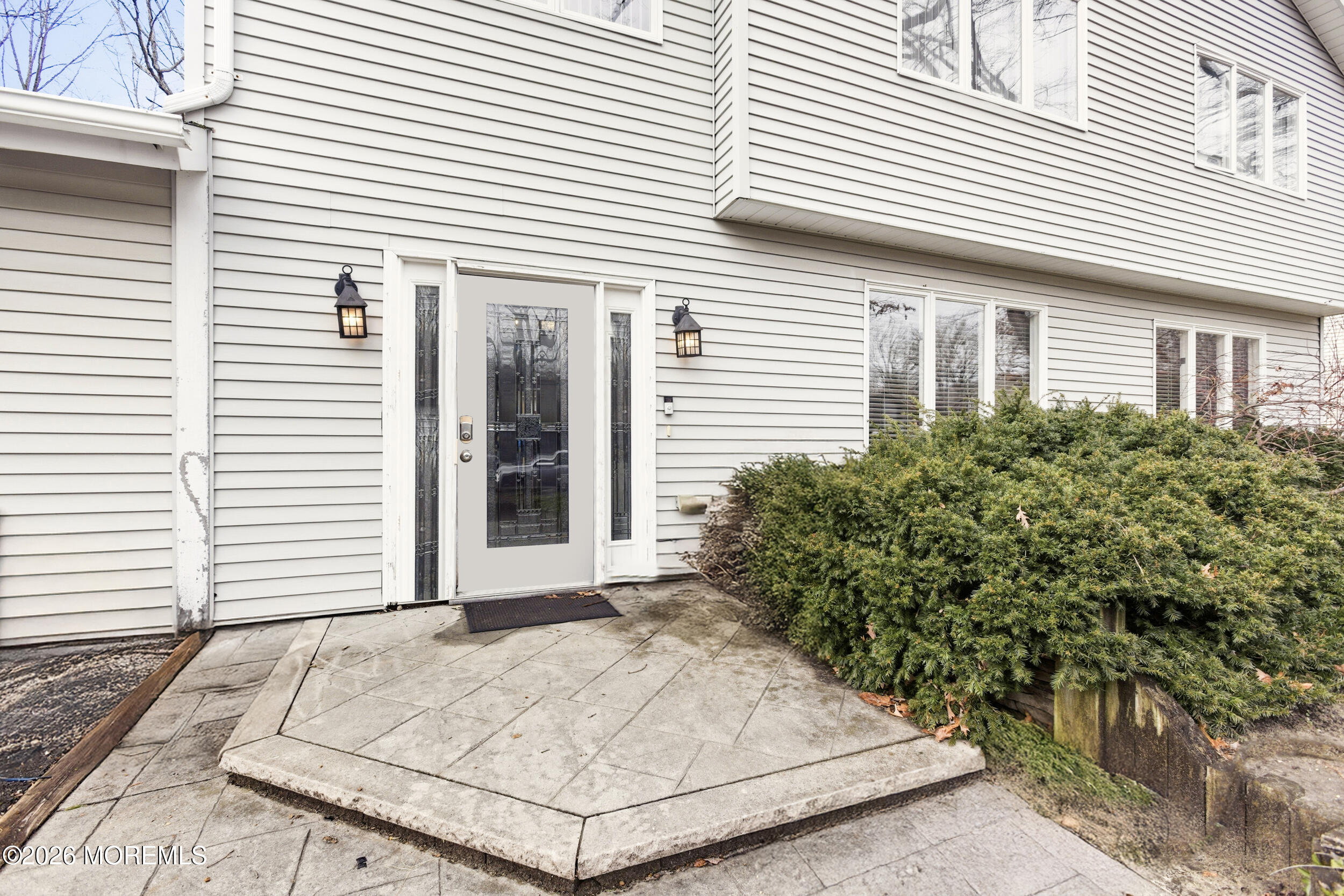 31 Chelsea Road Jackson, NJ 08527 - Photo 55 of 57 a view of a white house with a potted plant