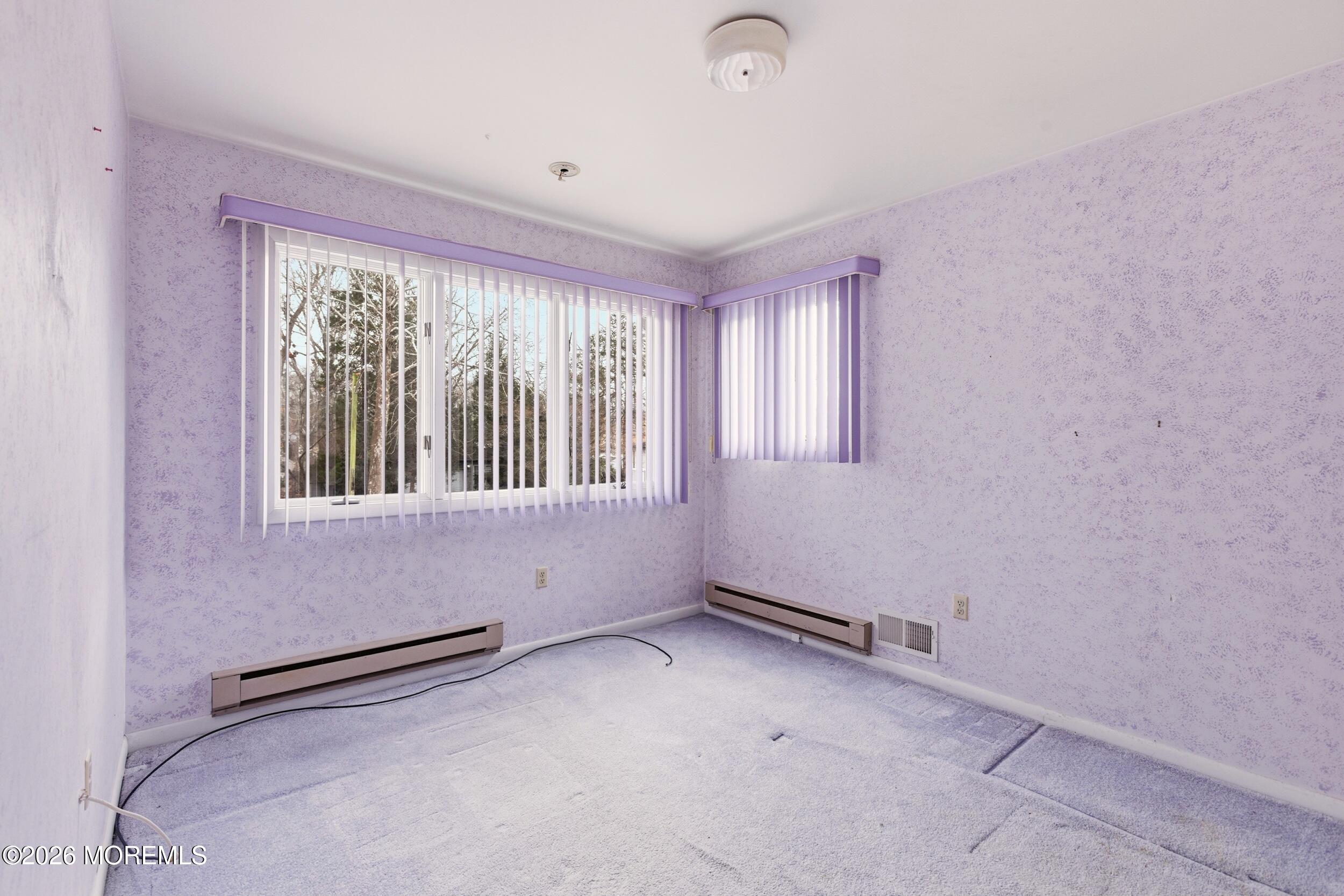 31 Chelsea Road Jackson, NJ 08527 - Photo 6 of 57 an empty room with a empty space and windows