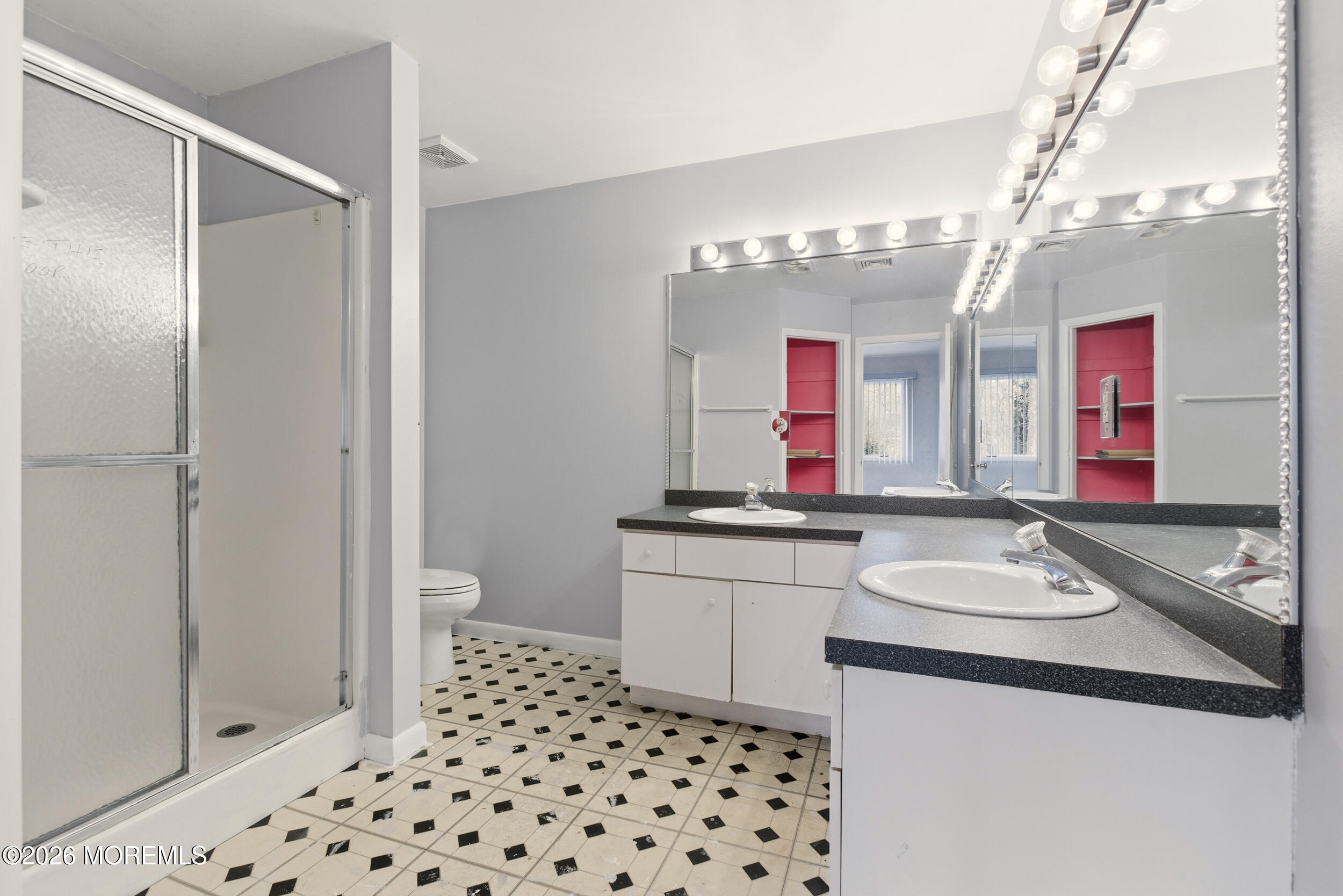 31 Chelsea Road Jackson, NJ 08527 - Photo 9 of 57 a bathroom with a sink and a mirror