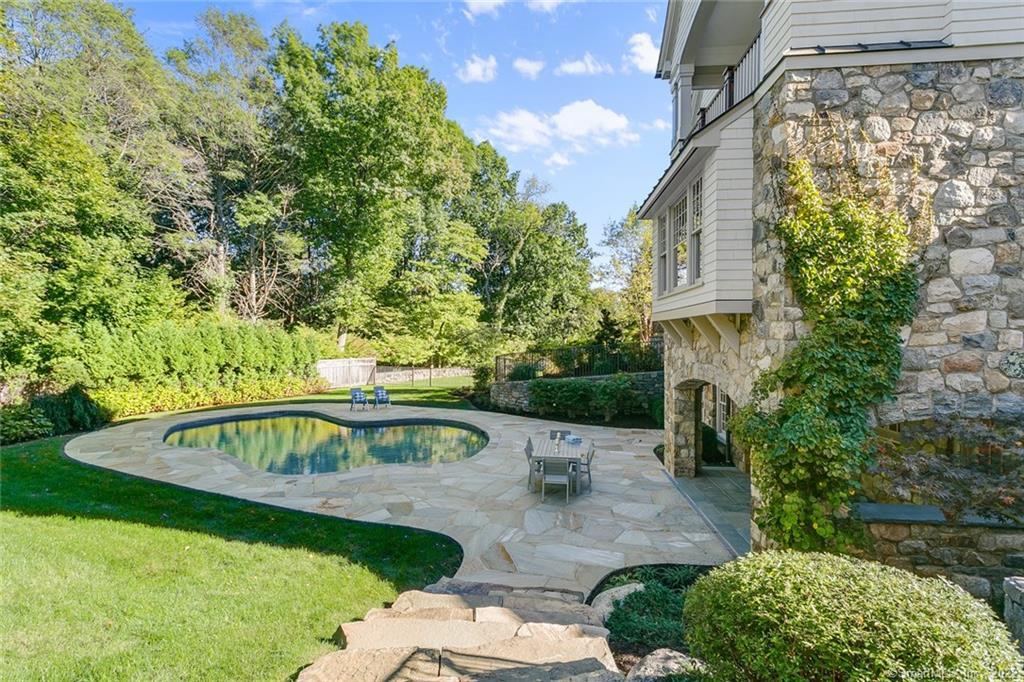 5 Devon Road Westport, CT 06880 - Photo 1 of 1 a view of a swimming pool with a garden