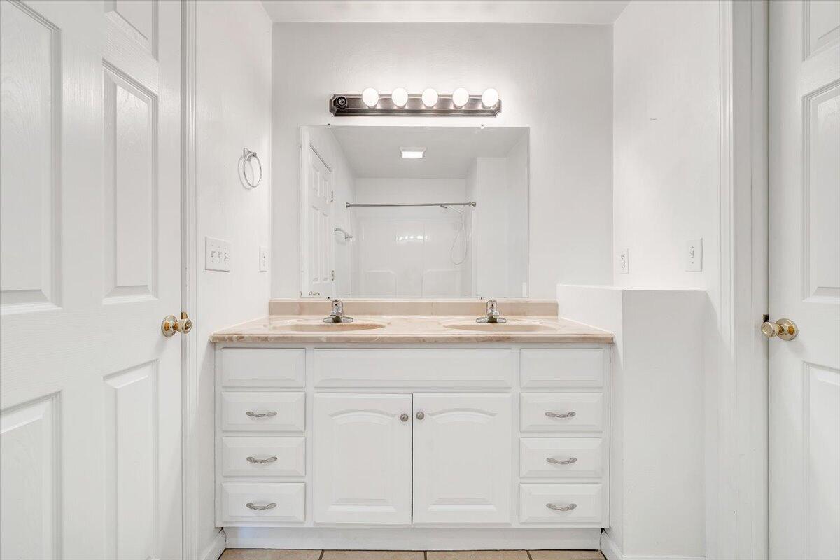 3824 Yellow Mountain Road Southeast Roanoke, VA 24014 - Photo 21 of 50 a bathroom with a double vanity sink and mirror