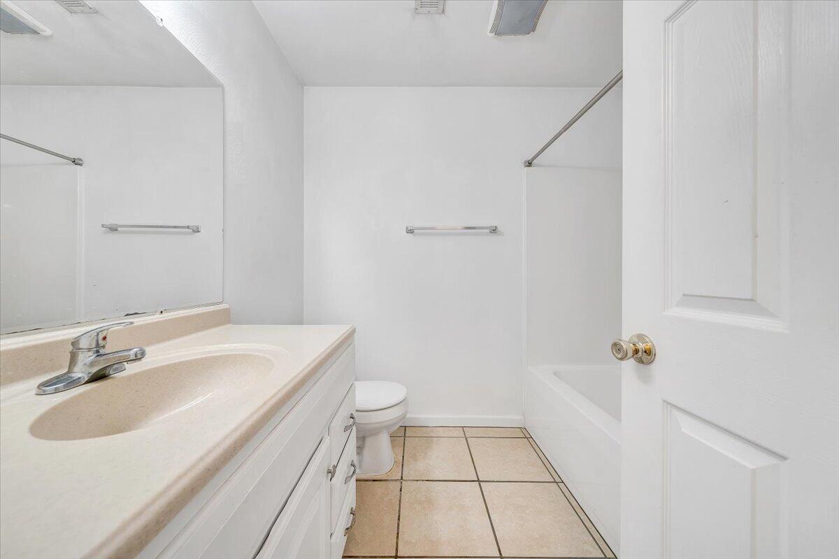 3824 Yellow Mountain Road Southeast Roanoke, VA 24014 - Photo 27 of 50 a bathroom with a sink toilet and shower