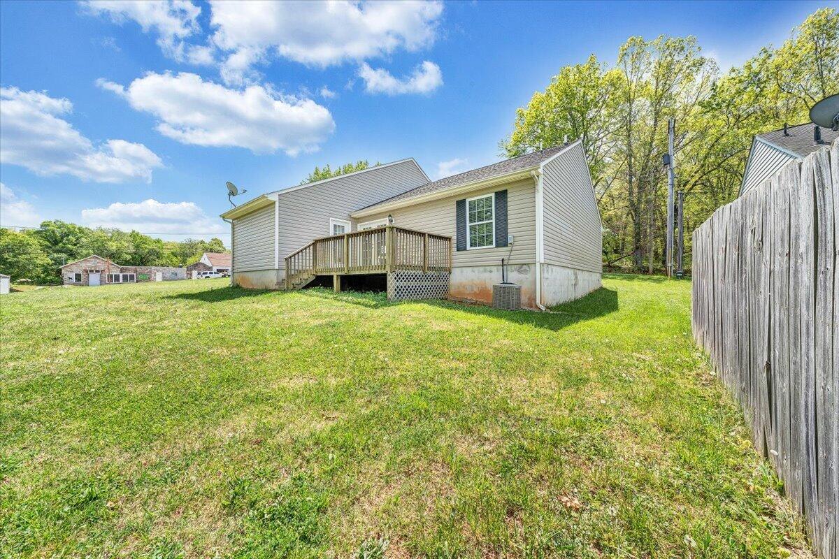 3824 Yellow Mountain Road Southeast Roanoke, VA 24014 - Photo 36 of 50 a view of a house with a yard and sitting area