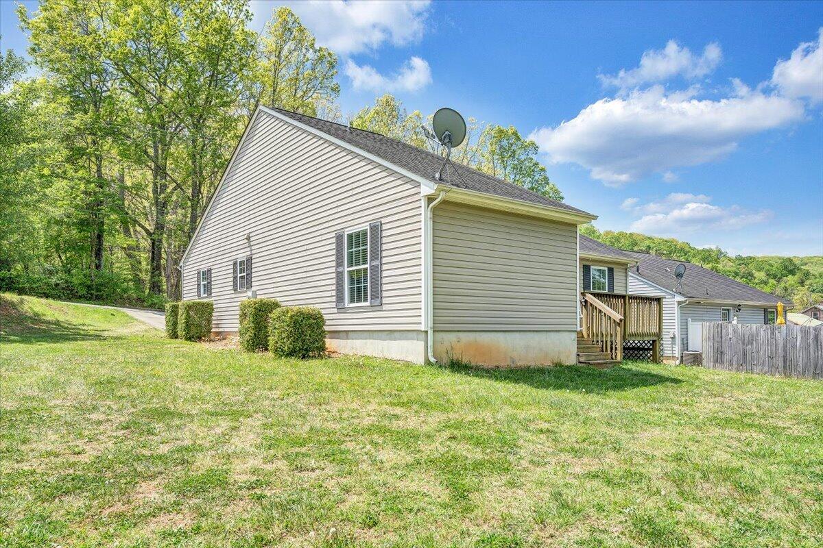 3824 Yellow Mountain Road Southeast Roanoke, VA 24014 - Photo 39 of 50 a view of a house with a yard and garage