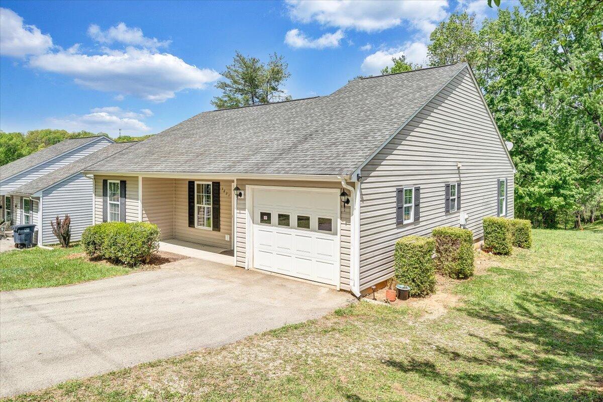 3824 Yellow Mountain Road Southeast Roanoke, VA 24014 - Photo 45 of 50 a front view of a house with a yard and garage