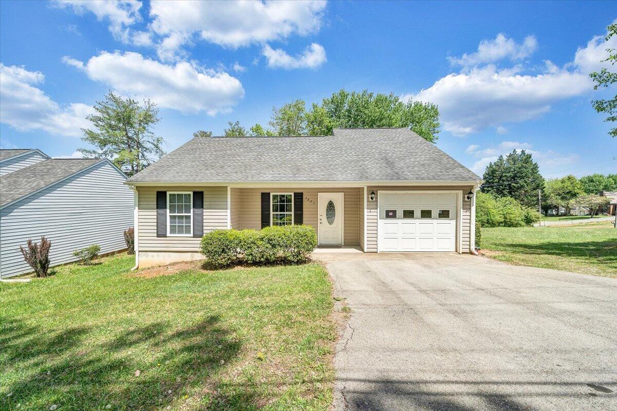 3824 Yellow Mountain Road Southeast Roanoke, VA 24014 - Photo 49 of 50 a front view of a house with a yard and garage