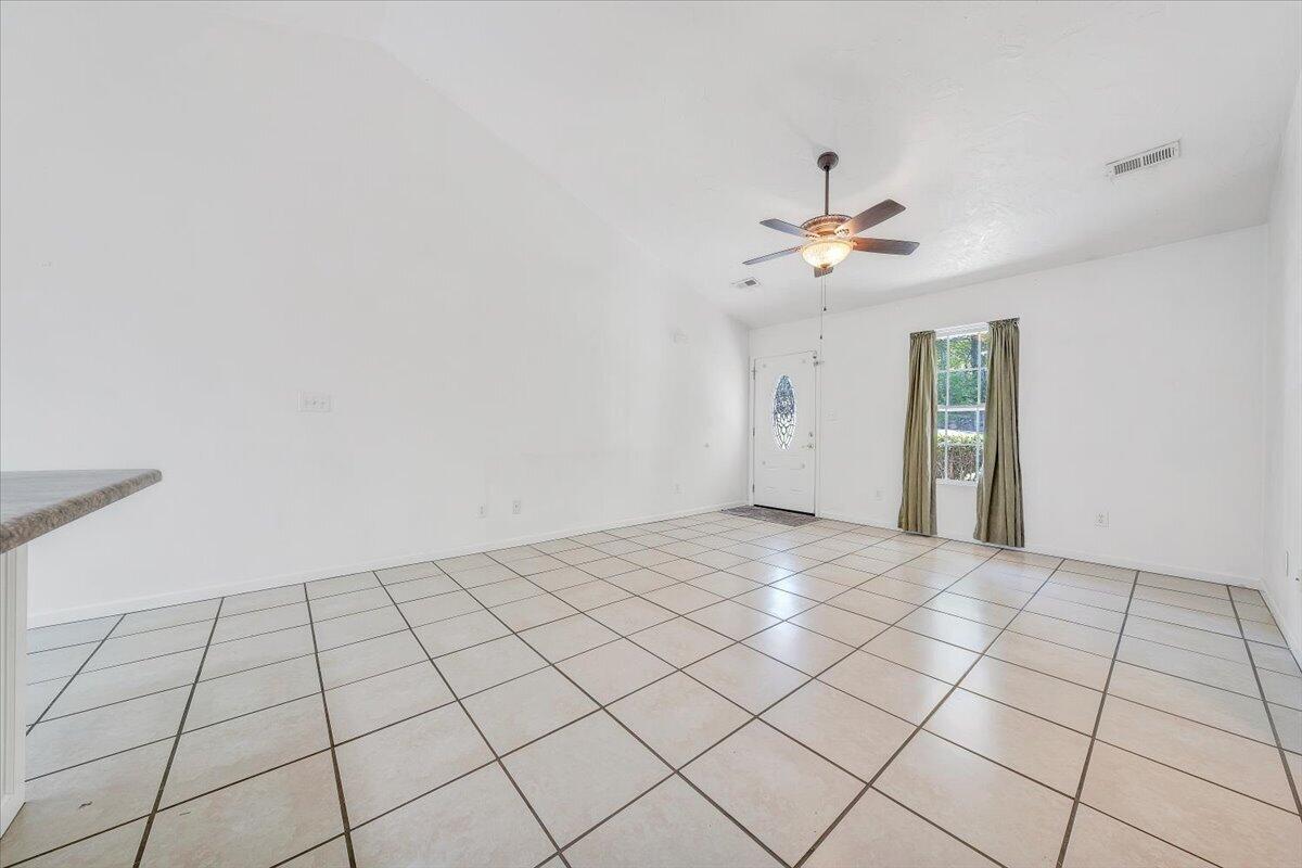 3824 Yellow Mountain Road Southeast Roanoke, VA 24014 - Photo 7 of 50 a view of an empty room and a chandelier fan