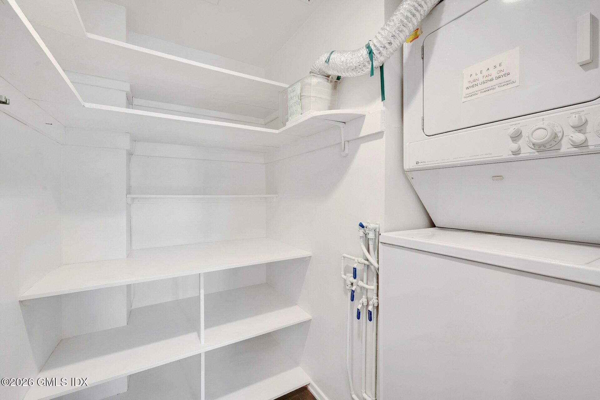 630 Steamboat Road, Unit 4AN Greenwich, CT 06830 - Photo 27 of 32 a view of storage and utility room with washer and dryer