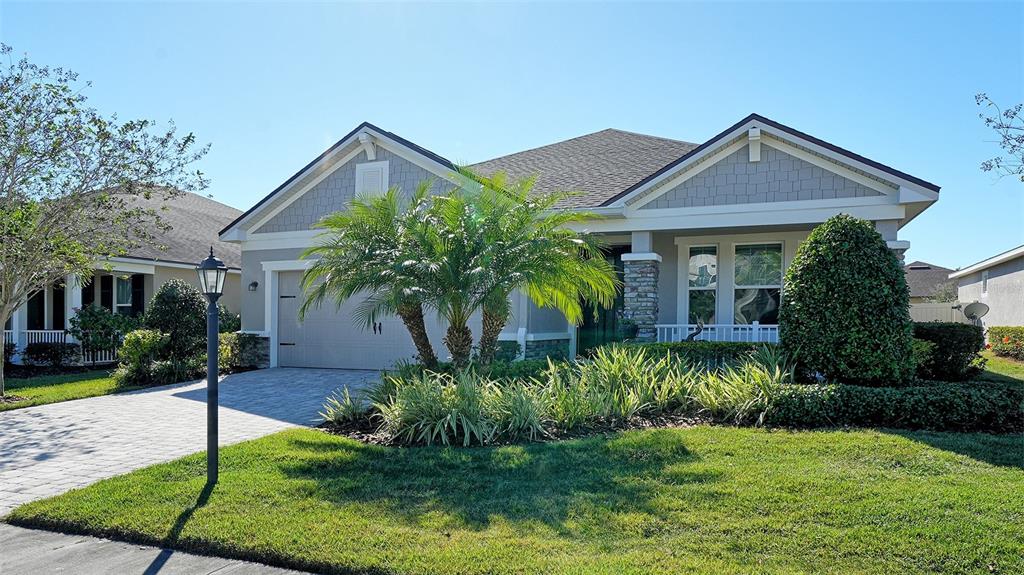 11211 Spring Gate Trail Lakewood Ranch, FL 34211 - Photo 1 of 51 a front view of house with yard and green space