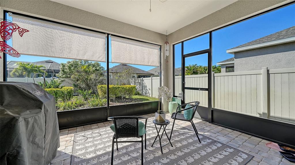 11211 Spring Gate Trail Lakewood Ranch, FL 34211 - Photo 14 of 51 a view of a porch with furniture and a yard