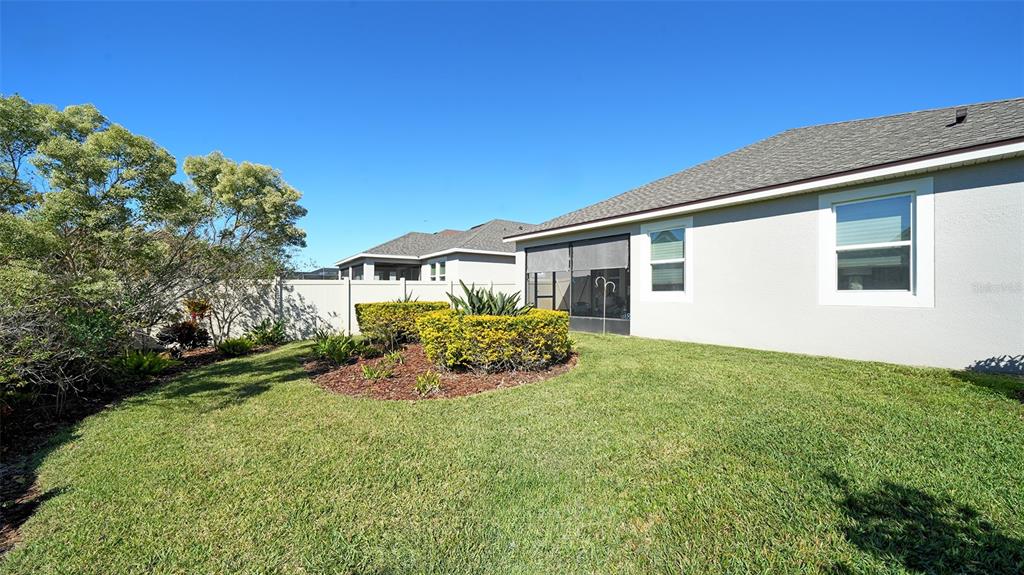11211 Spring Gate Trail Lakewood Ranch, FL 34211 - Photo 38 of 51 a front view of a house with garden