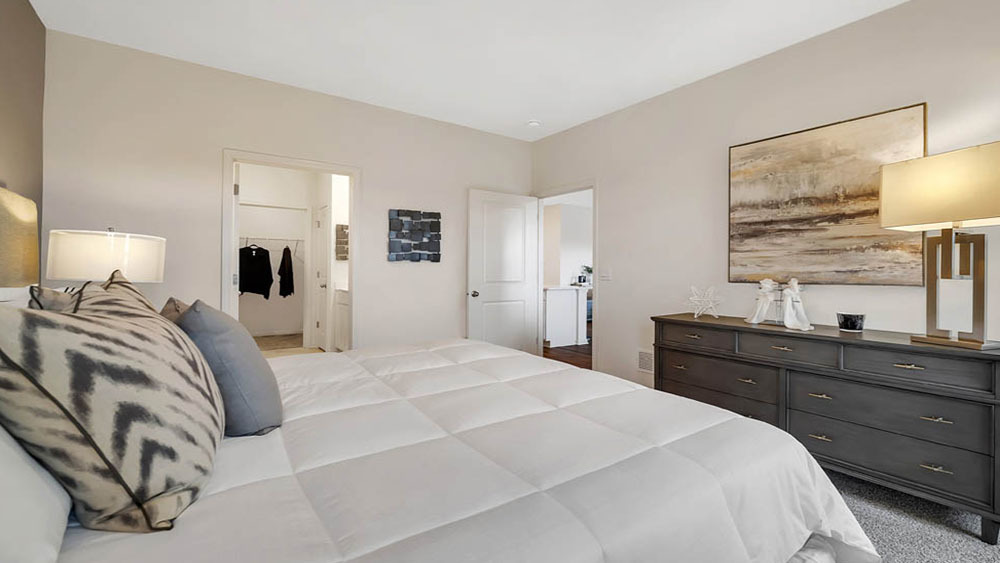 1114 Bluebell Lane Bartlett, IL 60103 - Photo 15 of 16 a bedroom with a bed and a lamp on dresser