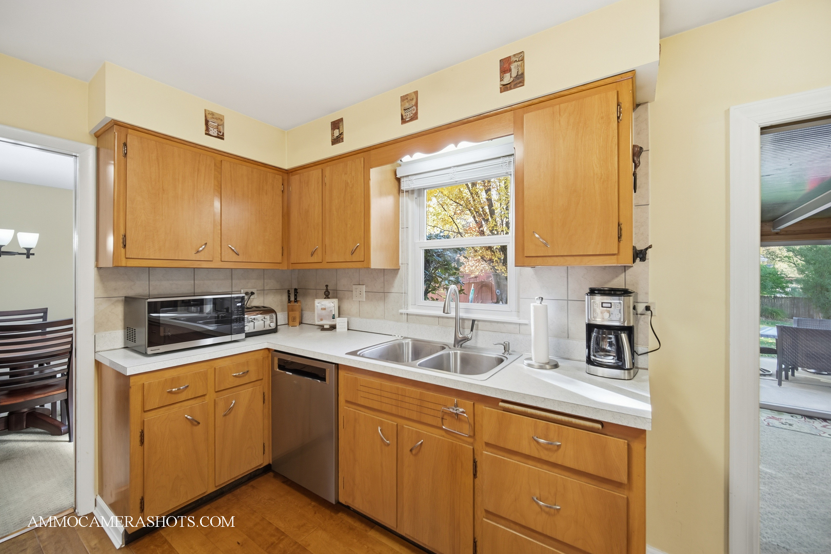 817 Woodland Hills Road Batavia, IL 60510 - Photo 11 of 38 a kitchen with sink cabinets and window