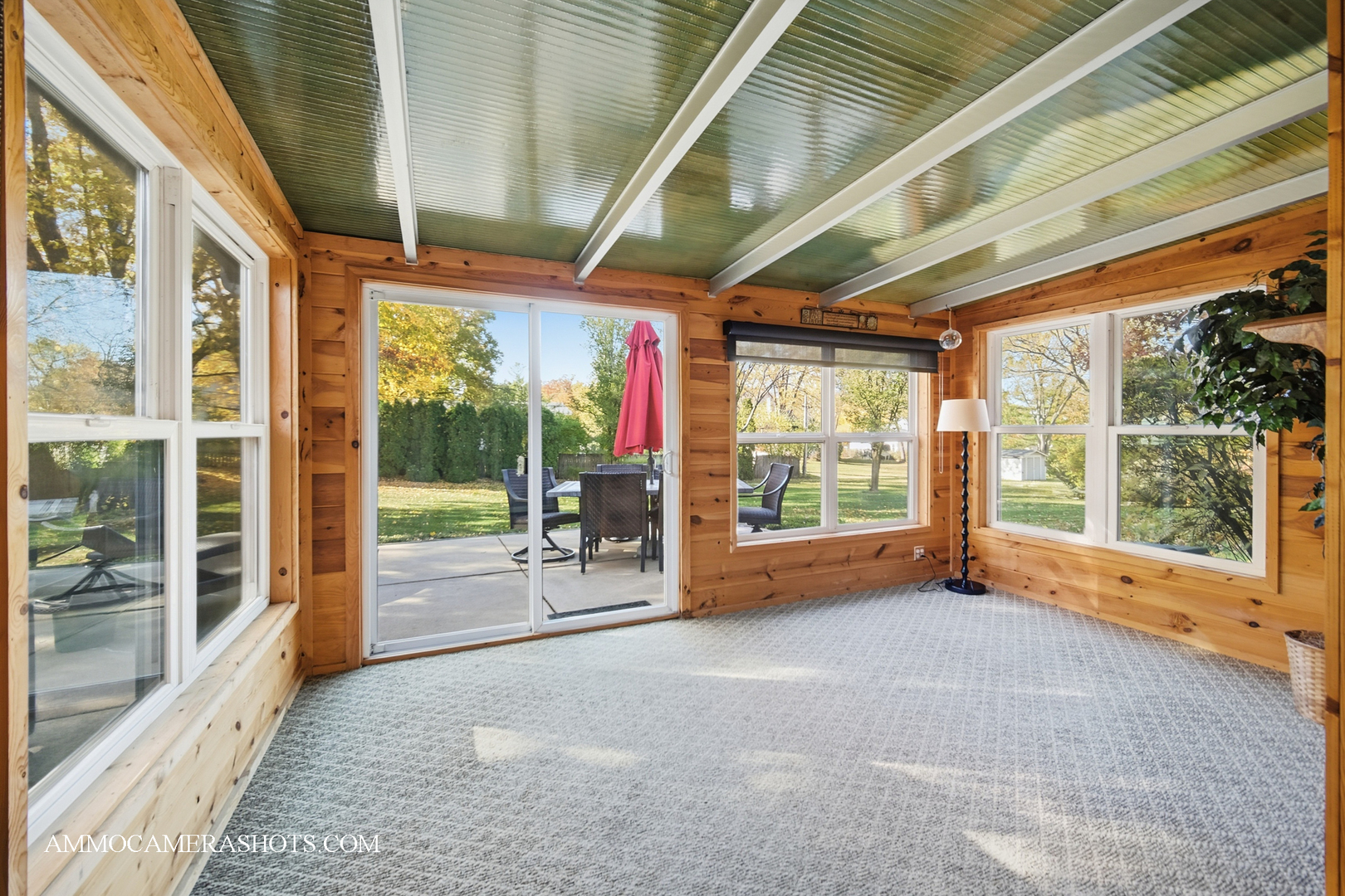 817 Woodland Hills Road Batavia, IL 60510 - Photo 13 of 38 a room with large windows and stairs