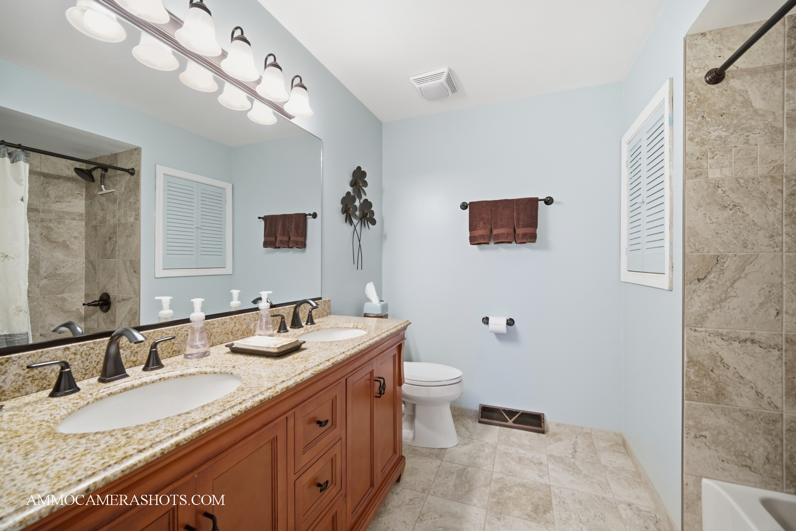 817 Woodland Hills Road Batavia, IL 60510 - Photo 16 of 38 a bathroom with a granite countertop double vanity sink a mirror and a toilet