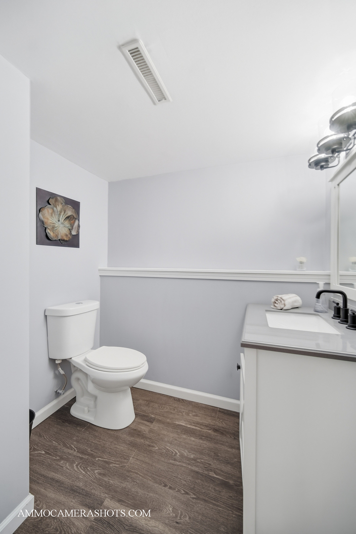 817 Woodland Hills Road Batavia, IL 60510 - Photo 21 of 38 a bathroom with a sink and a toilet
