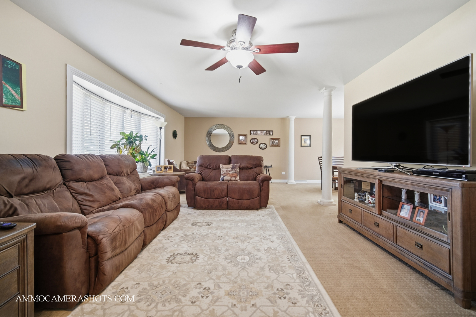 817 Woodland Hills Road Batavia, IL 60510 - Photo 5 of 38 a living room with furniture and a flat screen tv
