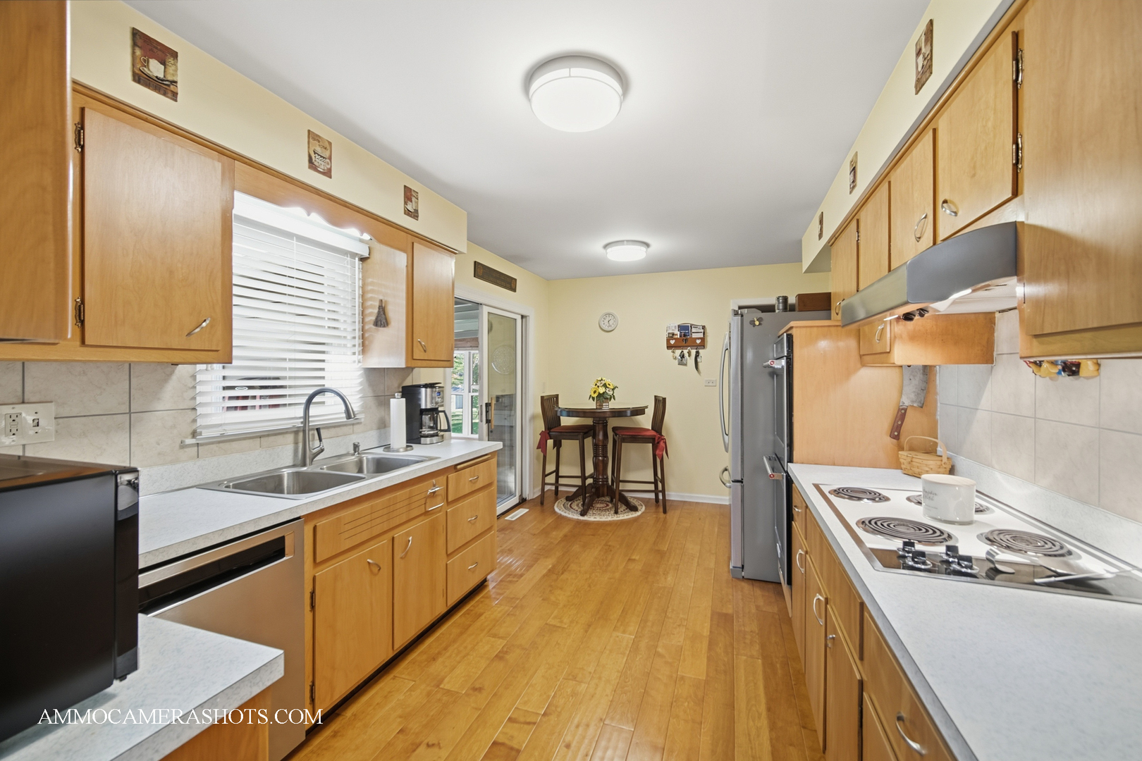 817 Woodland Hills Road Batavia, IL 60510 - Photo 9 of 38 a kitchen with wooden cabinets and stainless steel appliances