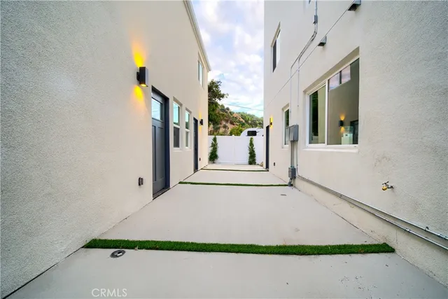 a view of a back yard with an empty space