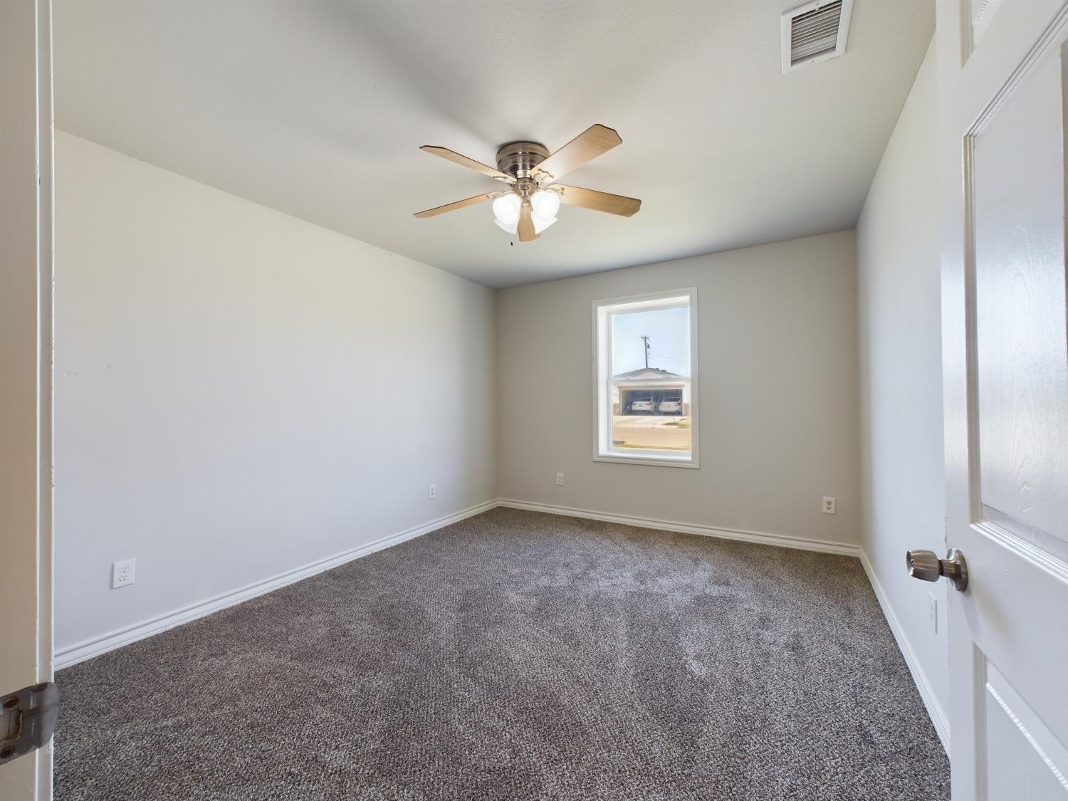 6306 25th Street Lubbock, TX 79407 - Photo 11 of 37 a view of an empty room with a window