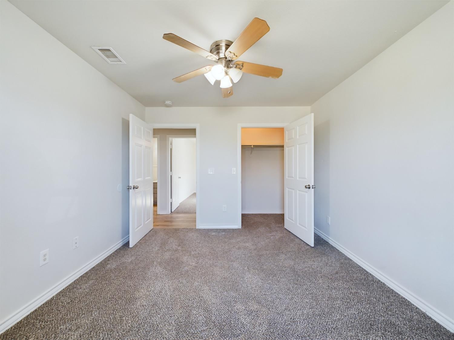 6306 25th Street Lubbock, TX 79407 - Photo 13 of 37 a view of an empty room with a ceiling fan