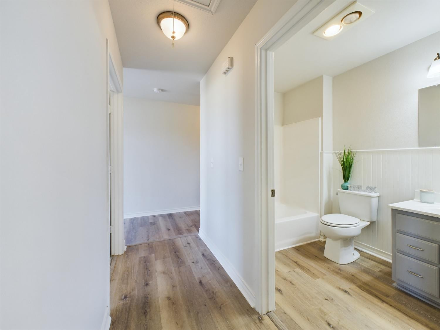 6306 25th Street Lubbock, TX 79407 - Photo 17 of 37 a bathroom with a toilet and a shower