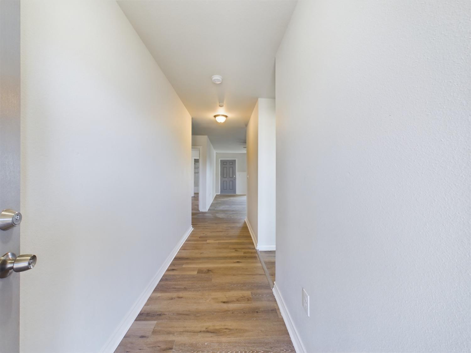 6306 25th Street Lubbock, TX 79407 - Photo 3 of 37 a view of a hallway with wooden floor