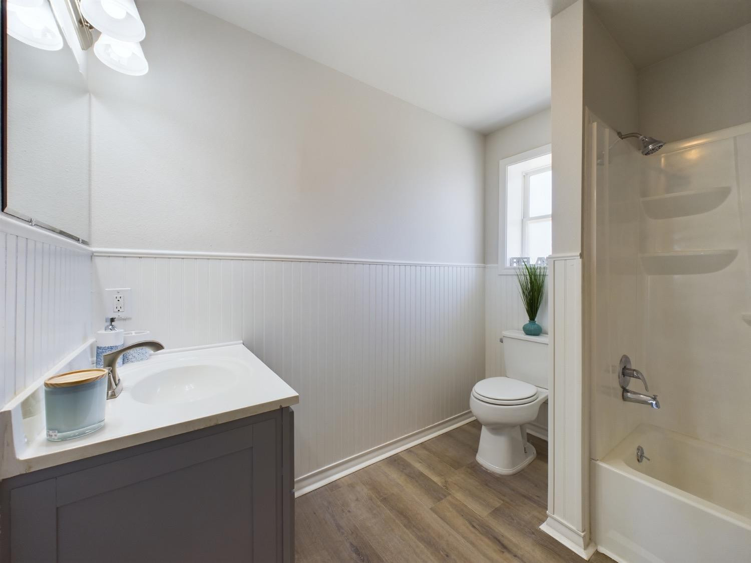 6306 25th Street Lubbock, TX 79407 - Photo 33 of 37 a bathroom with a sink a toilet and shower