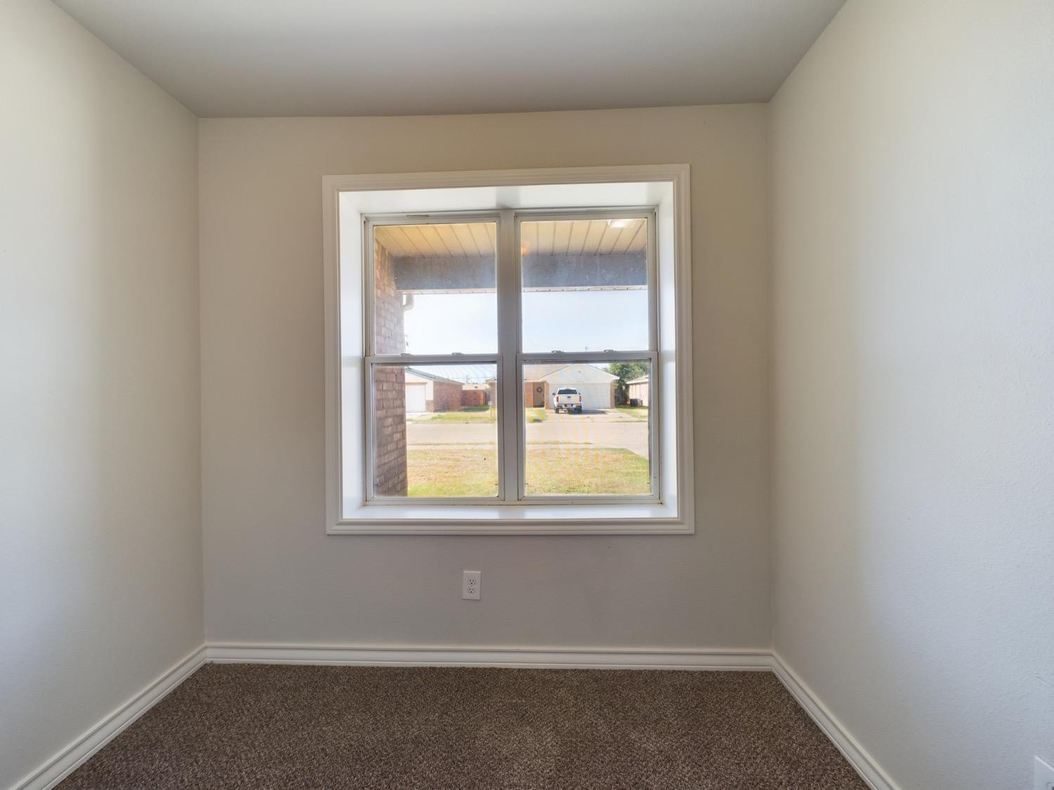 6306 25th Street Lubbock, TX 79407 - Photo 7 of 37 an empty room with a window
