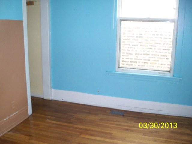 5010 North Troy Street Chicago, IL 60625 - Photo 16 of 19 a view of a room with wooden floor and natural light