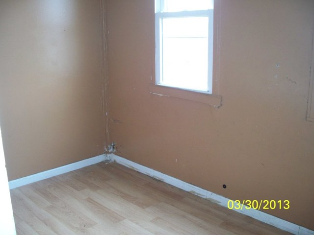 5010 North Troy Street Chicago, IL 60625 - Photo 18 of 19 an empty room with a window