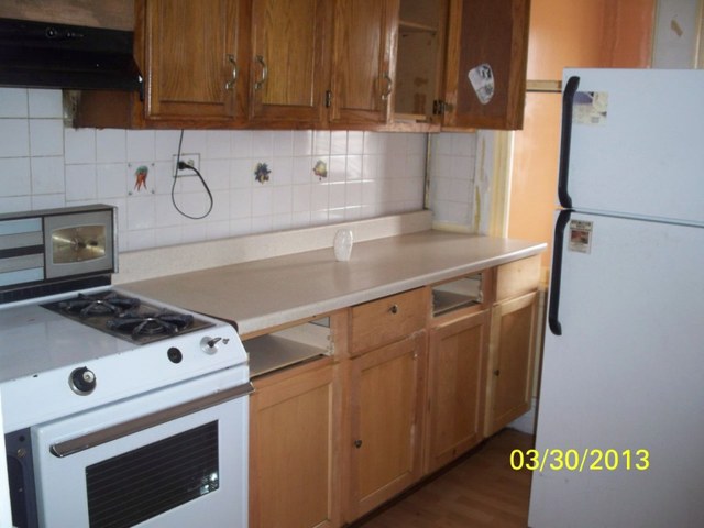 5010 North Troy Street Chicago, IL 60625 - Photo 2 of 19 a white stove top oven sitting inside of a kitchen