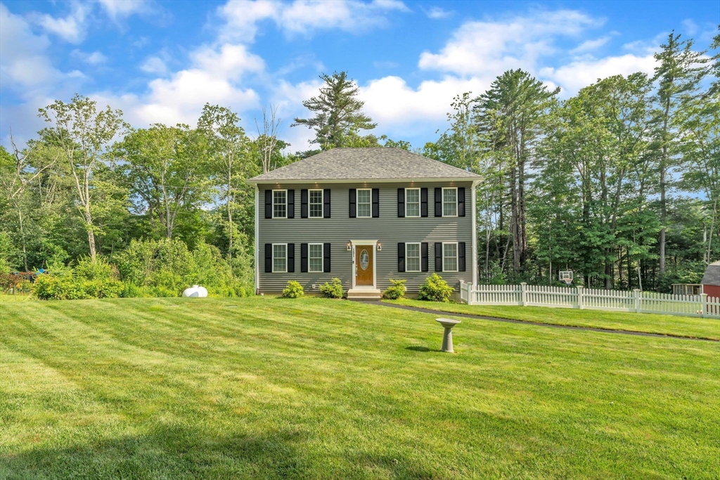 a view of a house with a big yard