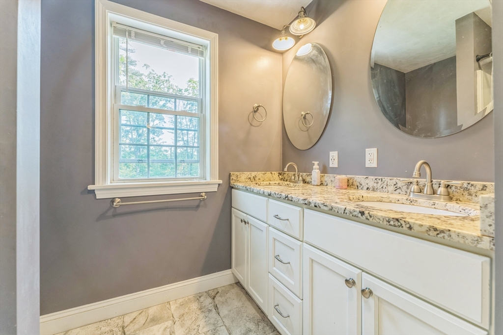121 Adams Road East Brookfield, MA 01515 - Photo 17 of 28 a bathroom with a granite countertop double vanity sink and a mirror