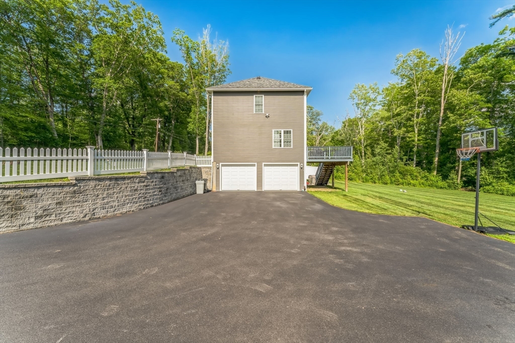 121 Adams Road East Brookfield, MA 01515 - Photo 24 of 28 a view of a backyard with a garden