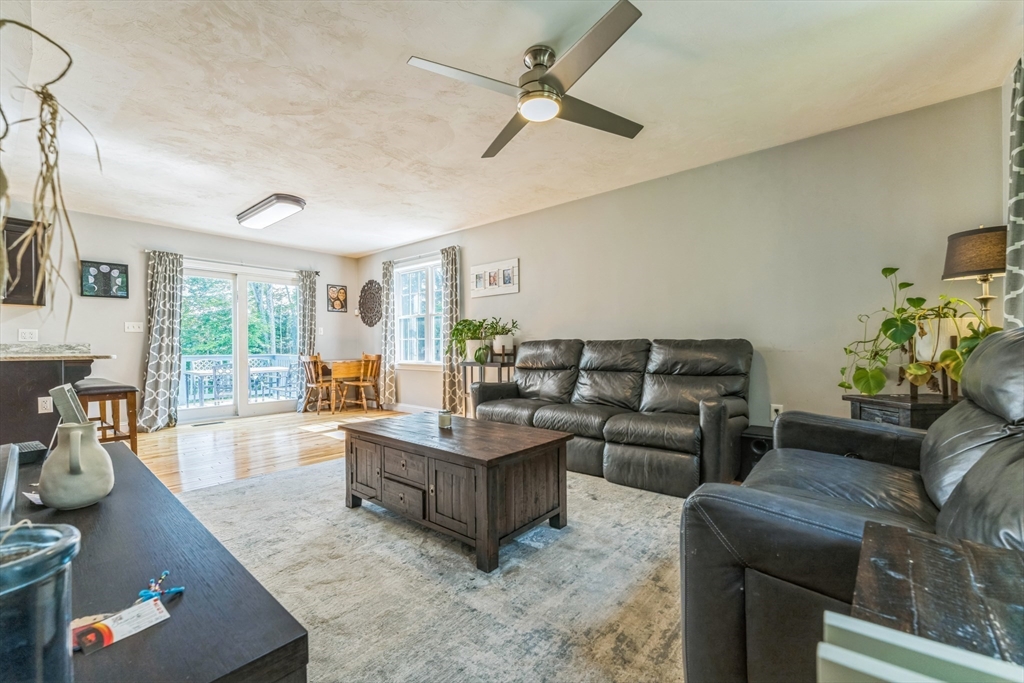 121 Adams Road East Brookfield, MA 01515 - Photo 8 of 28 a living room with furniture and a large window