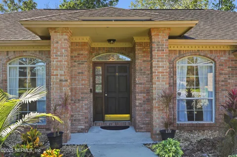 a front view of a house with outdoor seating