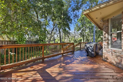 a view of a two chairs and table in the balcony