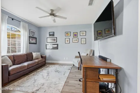 a living room with furniture and a window