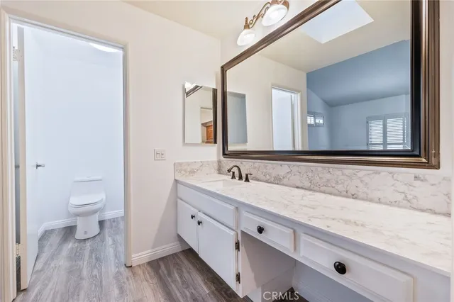 a white toilet sitting next to a bath tub and a shower
