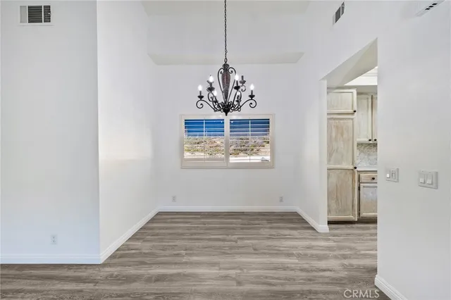 a view of a hallway with washer and dryer