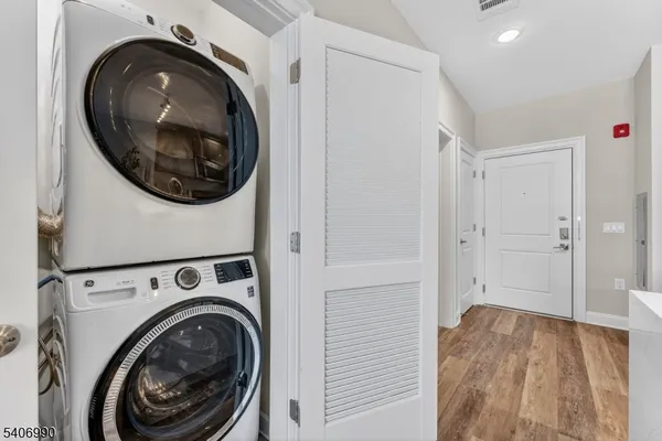 a view of a hallway with washer and dryer