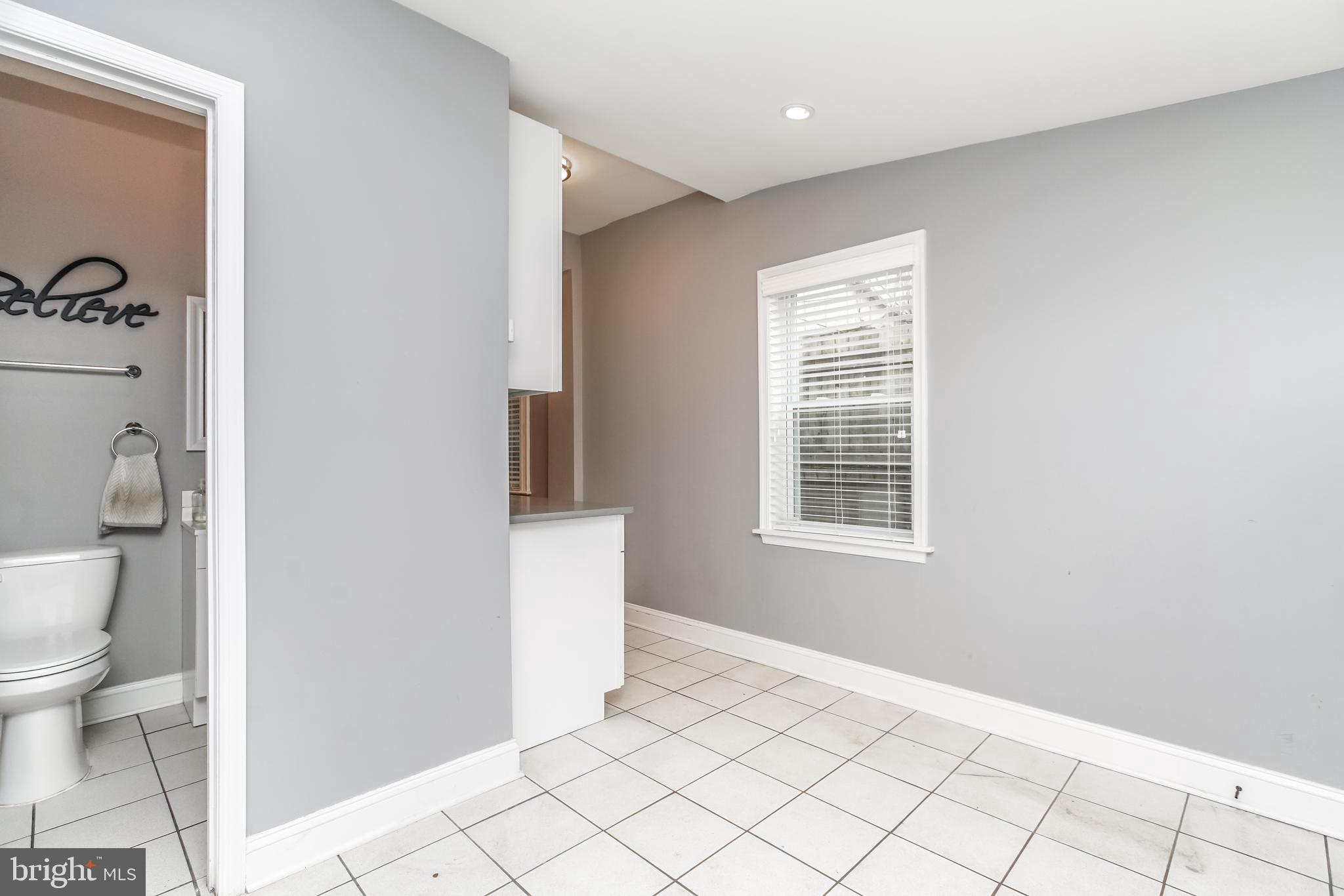 3537 Roland Avenue Baltimore, MD 21211 - Photo 14 of 36 Off the mudroom is a powder room.