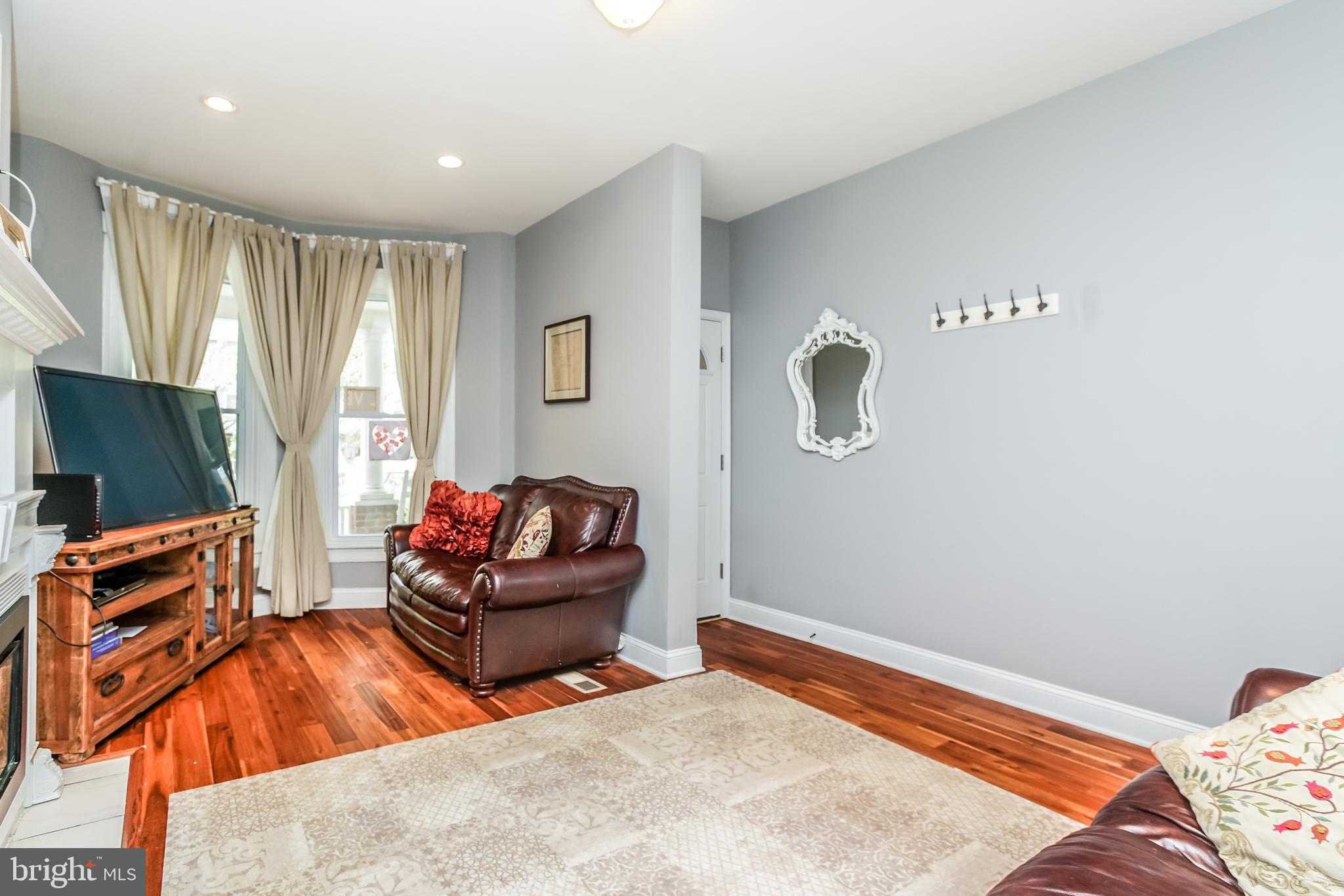 3537 Roland Avenue Baltimore, MD 21211 - Photo 4 of 36 The whole first floor has wood flooring.
