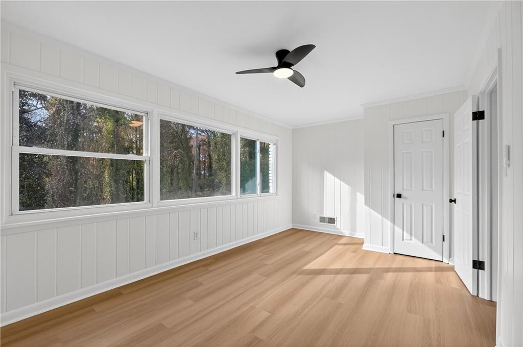 2967 Flat Shoals Road Decatur, GA 30034 - Photo 20 of 37 a view of an empty room with a window and wooden floor