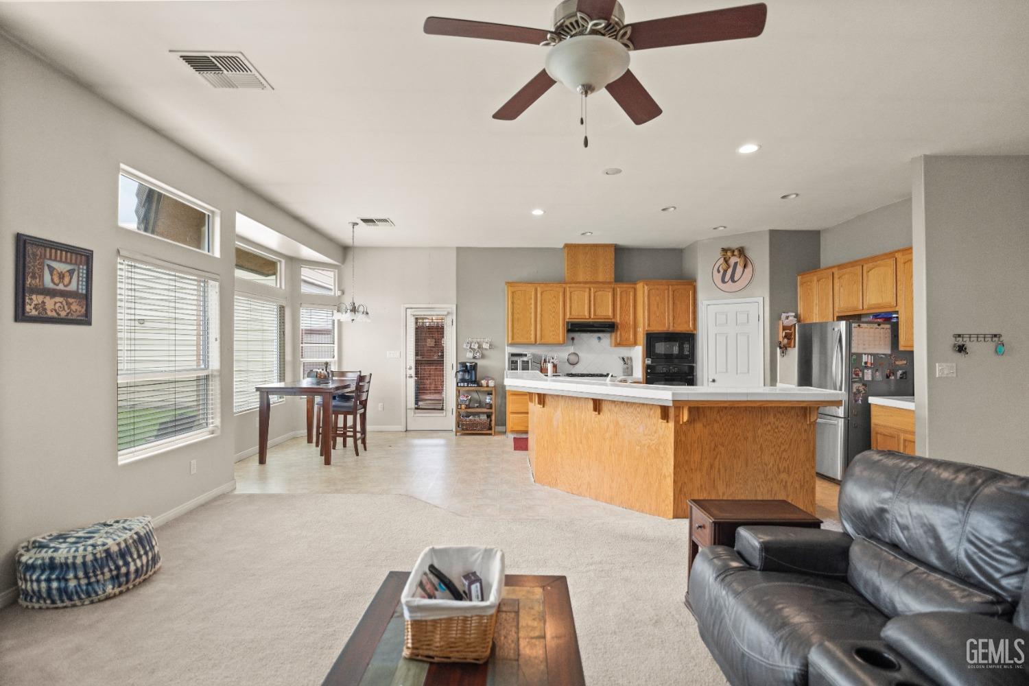 Undisclosed Address Bakersfield, CA 93306 - Photo 11 of 42 a living room with furniture and a large window