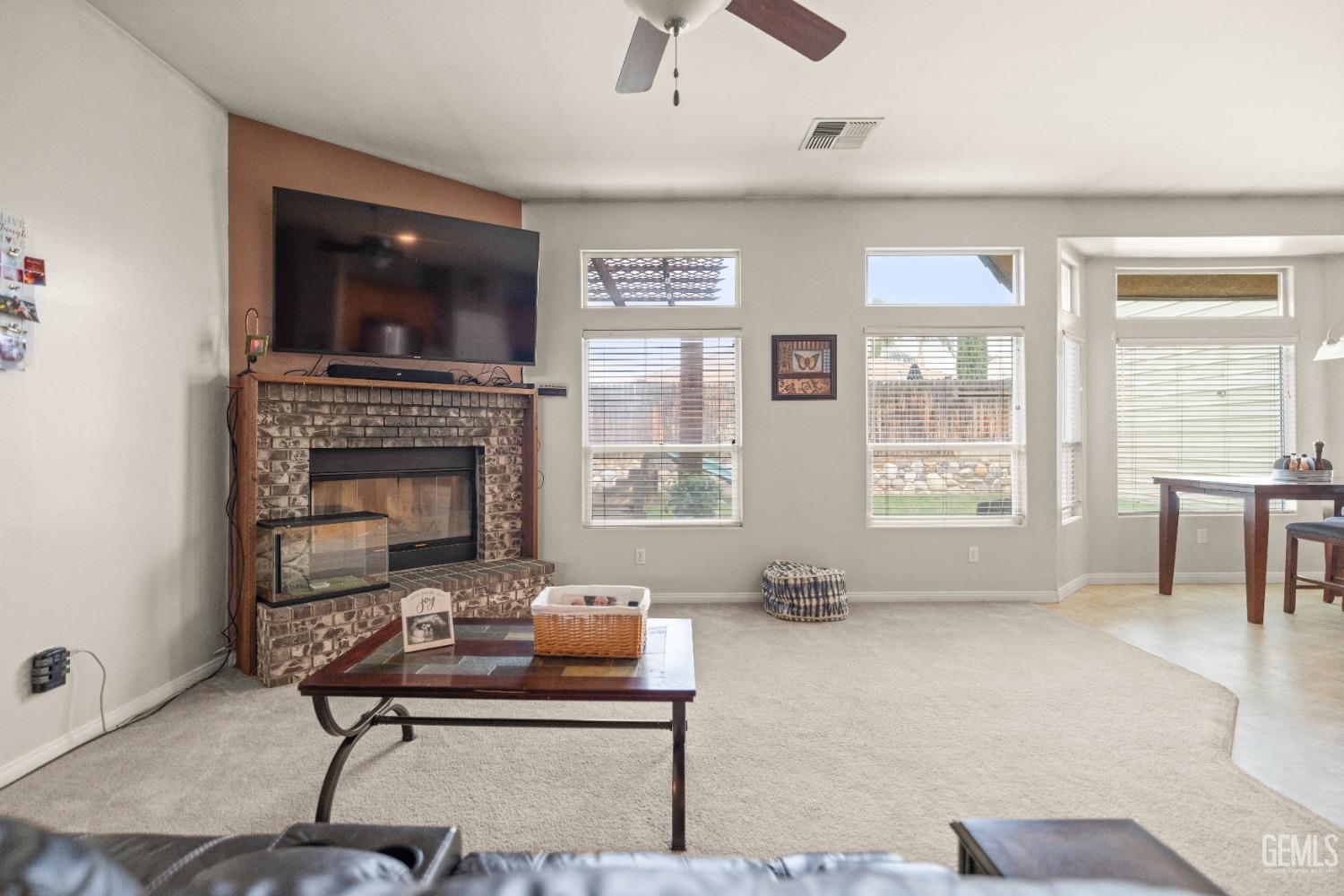 Undisclosed Address Bakersfield, CA 93306 - Photo 22 of 42 a living room with furniture and a fireplace