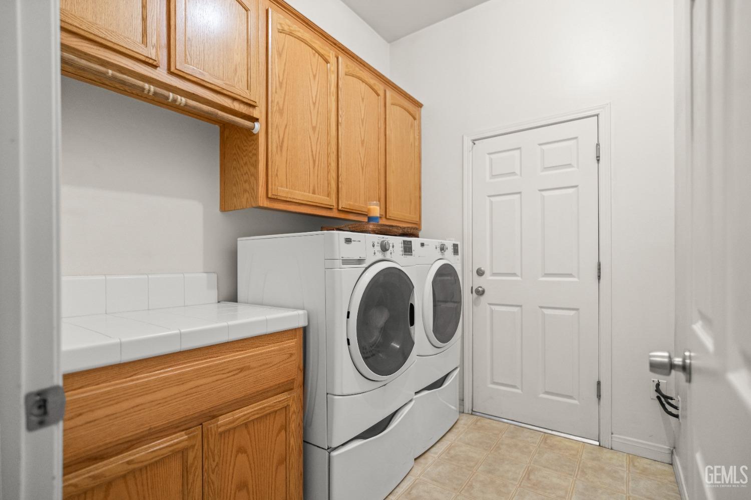 Undisclosed Address Bakersfield, CA 93306 - Photo 24 of 42 a utility room with dryer and washer